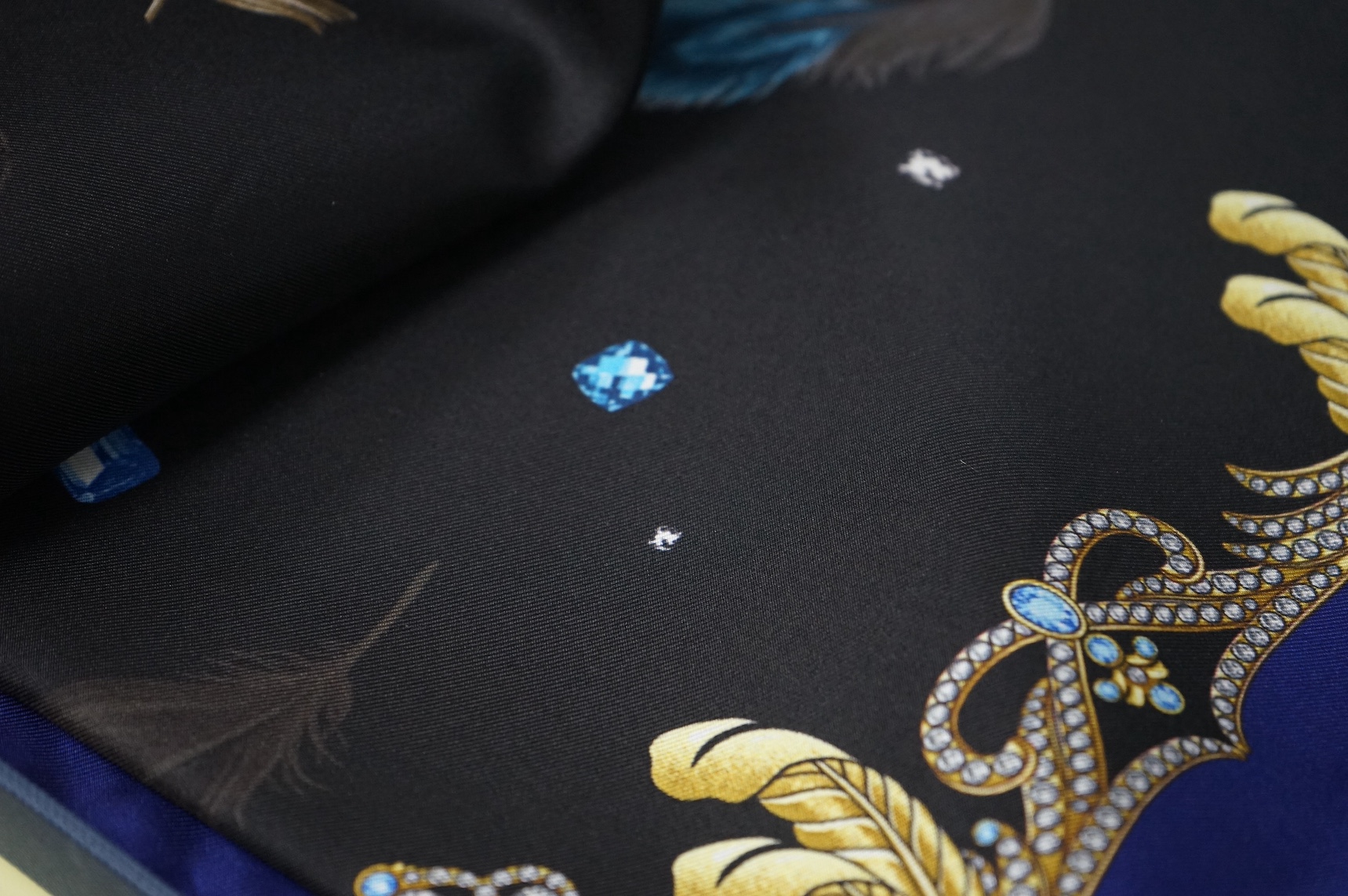 Aspinal of London silk scarf, with a printed feather design, boxed, 80cm x 85cm. Condition - good